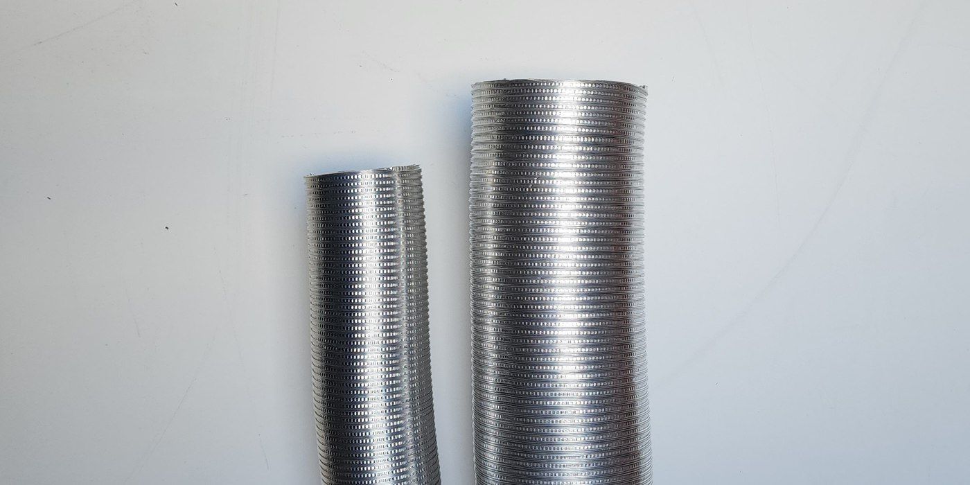 A three-inch and five-inch round stainless steel chimney liner lined up next to each other against a white backdrop