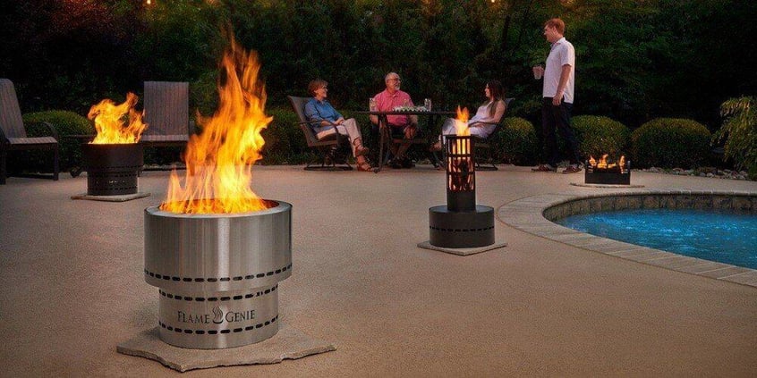The entire line of Flame Genie products in use in a back yard next to a pool. A family can be seen relaxing at a patio table in the background.