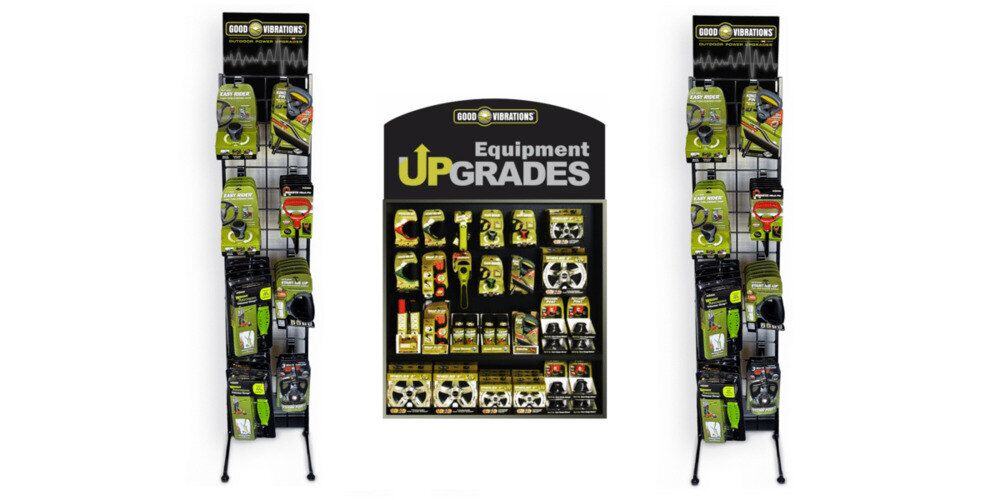 A Good Vibrations retail display flanked on either side by two wire racks with Good Vibrations products.