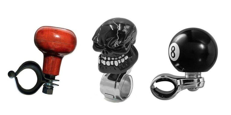 Three steering wheel knobs displayed against a white background.