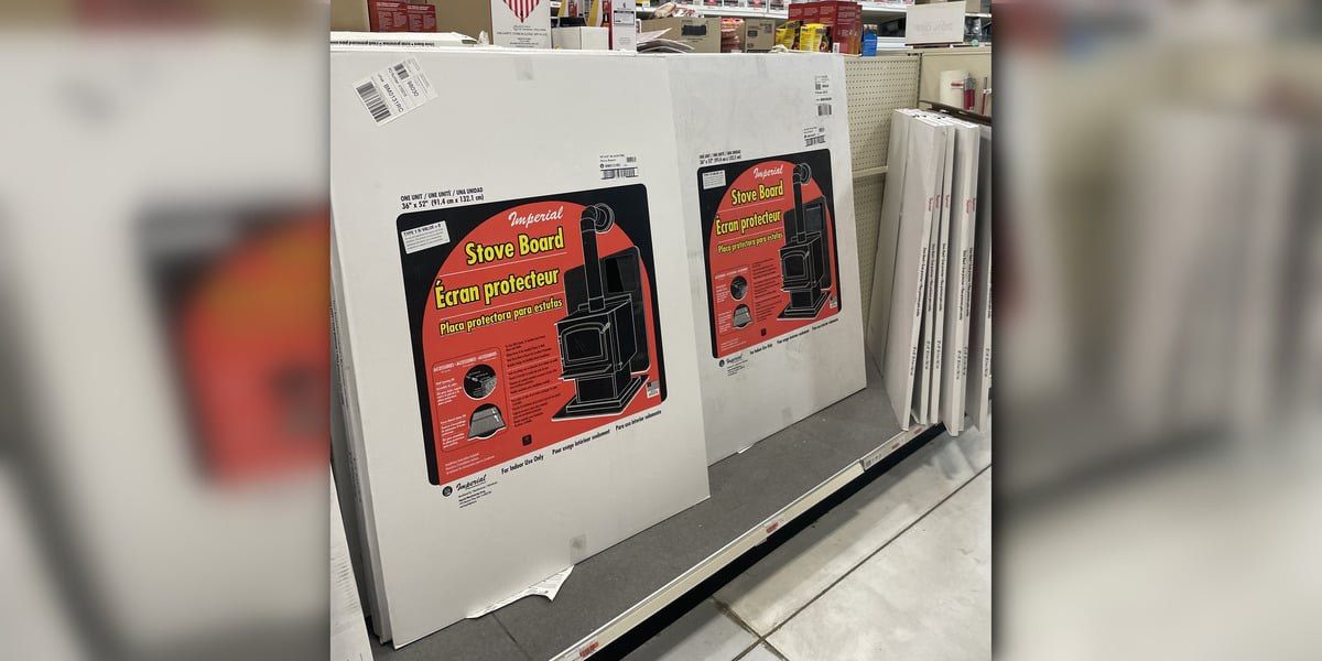 Stove boards being displayed in their boxes on a retail shelf