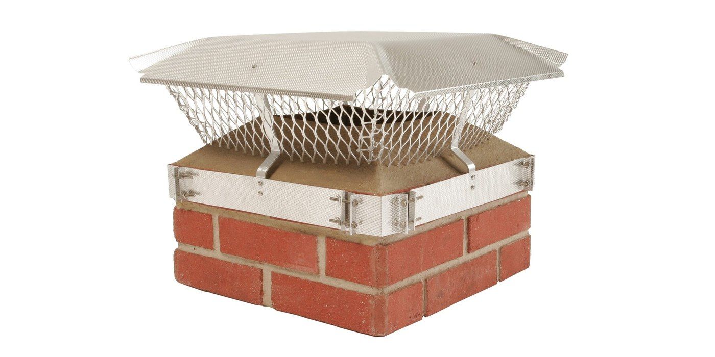A Draft King band-around-brick chimney cap installed on a mock chimney against a white background.