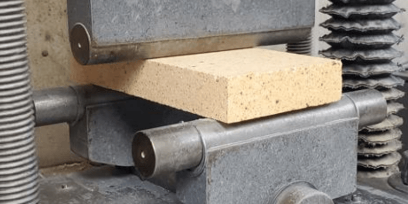 An Alsey Refractories Co. firebrick undergoing a modulus of rupture test in a testing laboratory.
