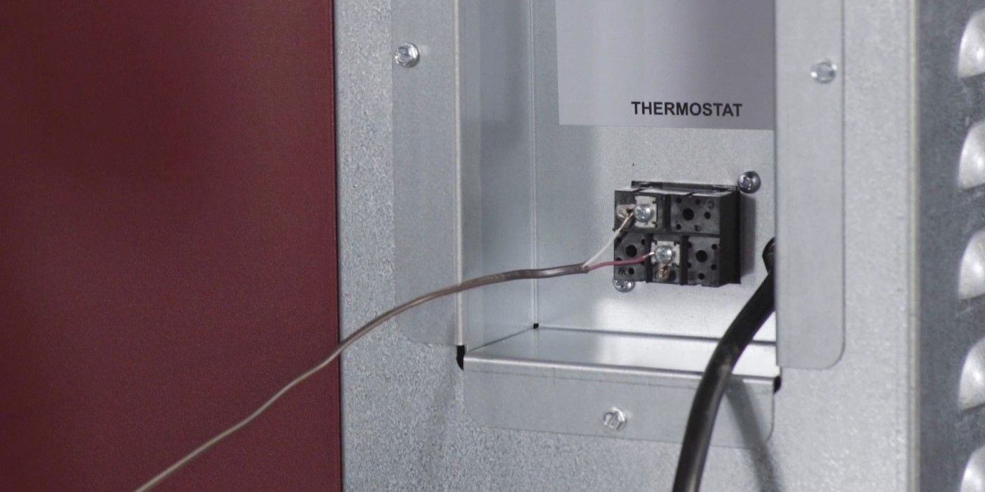A close-up of the thermostat connection on a Fire Chief FC1000E wood burning furnace.