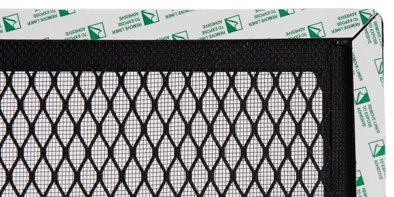 A close-up of a black HY-GUARD EXCLUSION Foundation Vent Screen with InsectArmor. The peel-and-stick foam around the edges are visible.