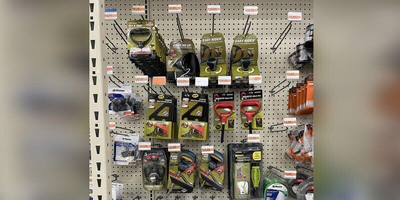 A spate of Good Vibrations products in an inline display on peg hooks in a hardware store.