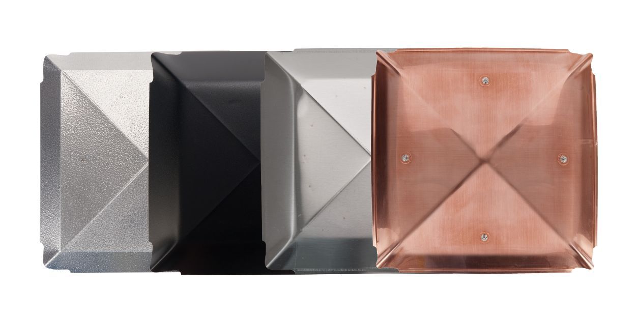 From left to right, all from a top-down perspective: the hood of an aluminum, galvanized steel, stainless steel, and copper chimney cap.
