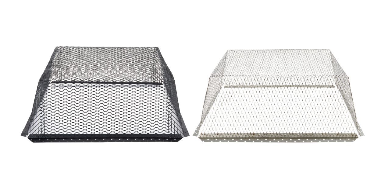 A 25" x 25" black galvanized steel roof vent guard sitting next to a 25" x 25" stainless steel roof vent guard against a white background.