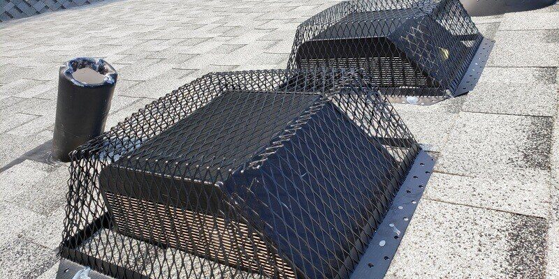 A pair of static roof vents that have been covered by HY-GUARD EXCLUSION Roof Vent Guards.