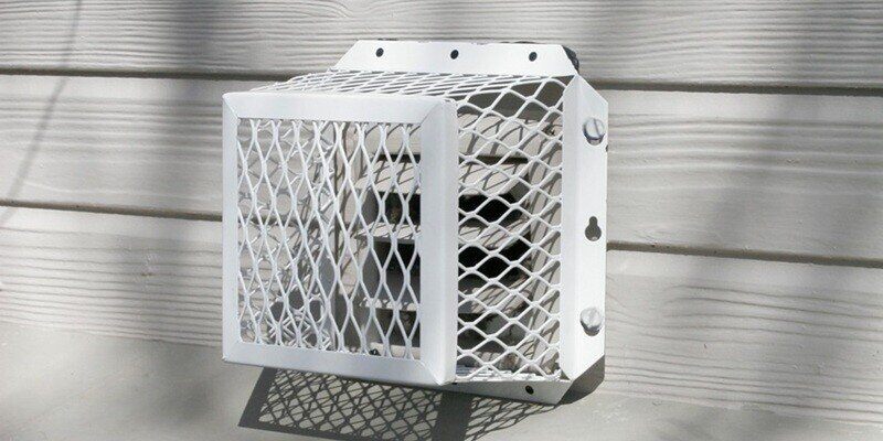 A bathroom vent on the side of a home that has been covered by a HY-GUARD EXCLUSION Universal Vent Guard.