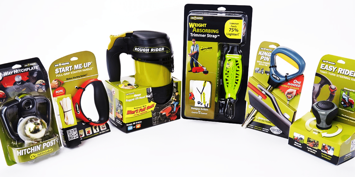 Good Vibrations products in their retail packaging from left to right: the Hitchin' Post+, the Start-Me-Up, the Rough Rider, the Zero Gravity Weight Absorbing Trimmer Strap, the King Pin, and the Easy Rider Tight Turn Steering Wheel Knob.